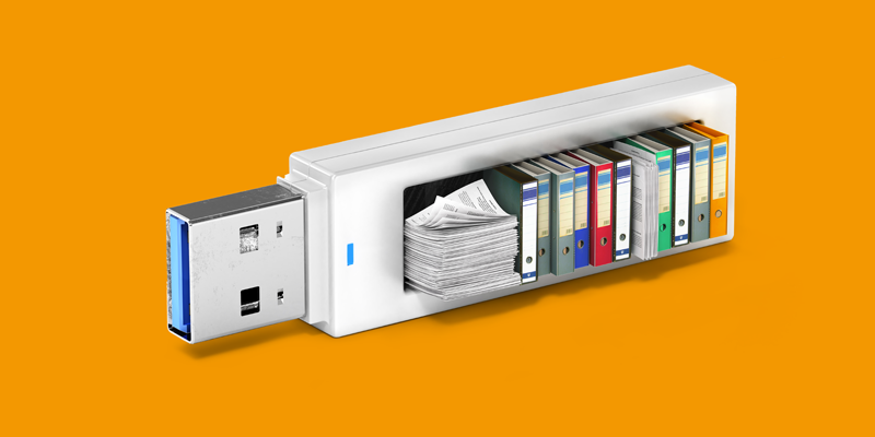 Een USB-stick die gevuld is met boeken, bestanden en mappen